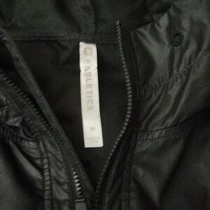 Fabletics black windbreaker with hood size medium.